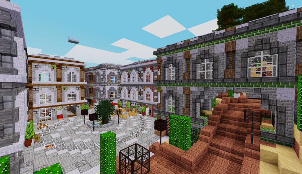 Stone courtyard with arched windows and brick stairs