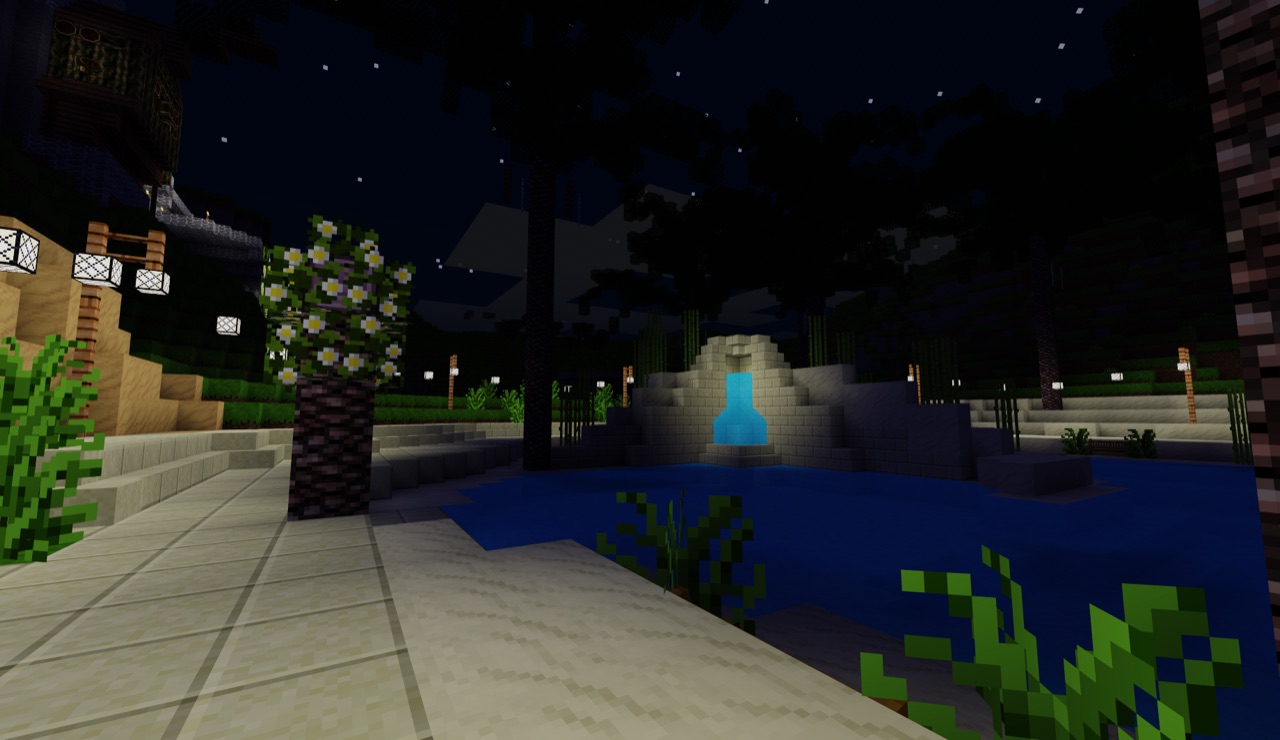 Fountain glowing under a starry night sky